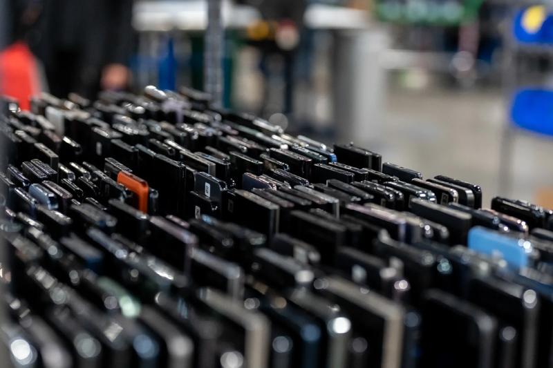 Rows of mobile devices awaiting processing for their next use.
