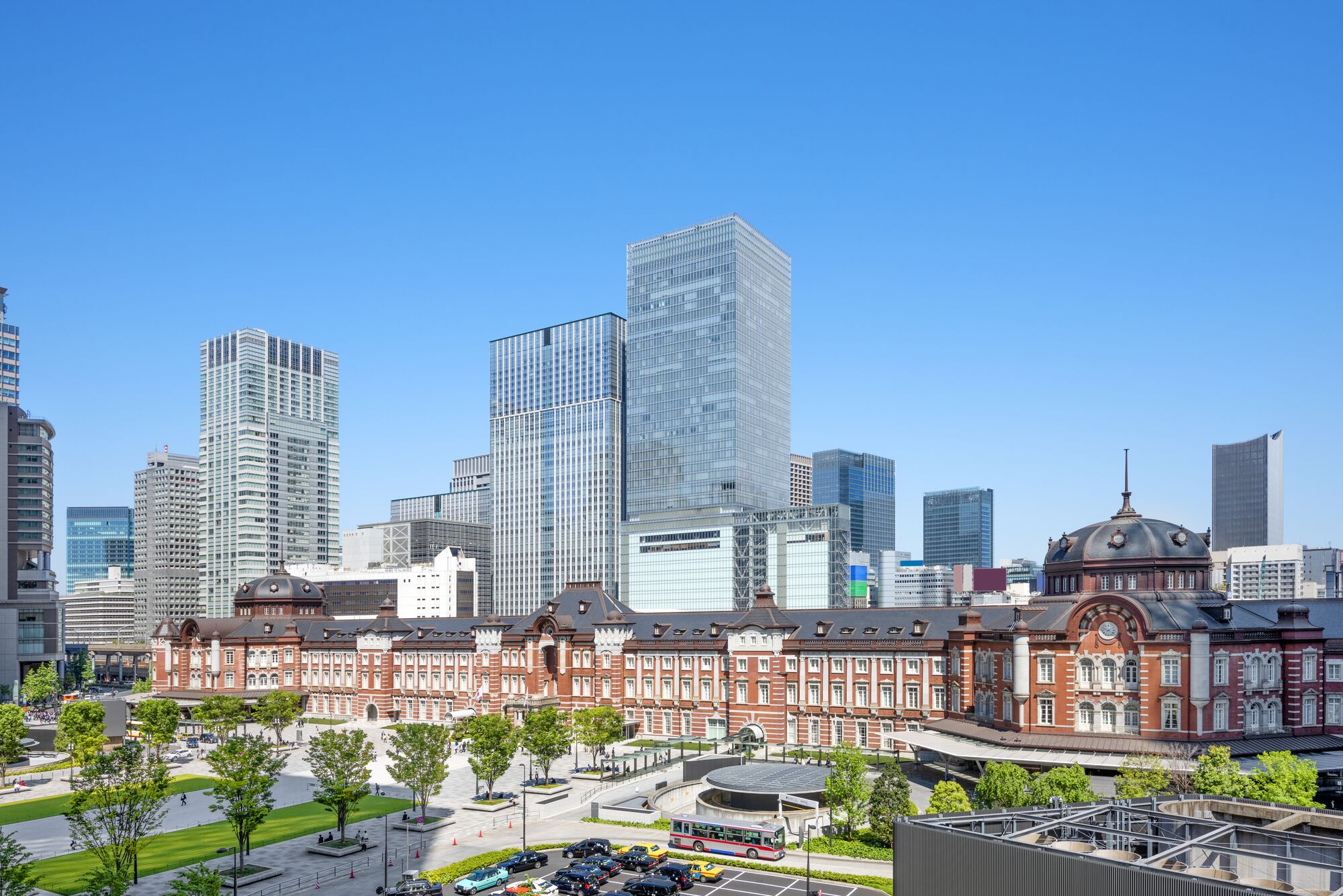 Tokyo Station and high-rise buildings including Assurant Japan office building- Marunouchi business district , Tokyo, Japan