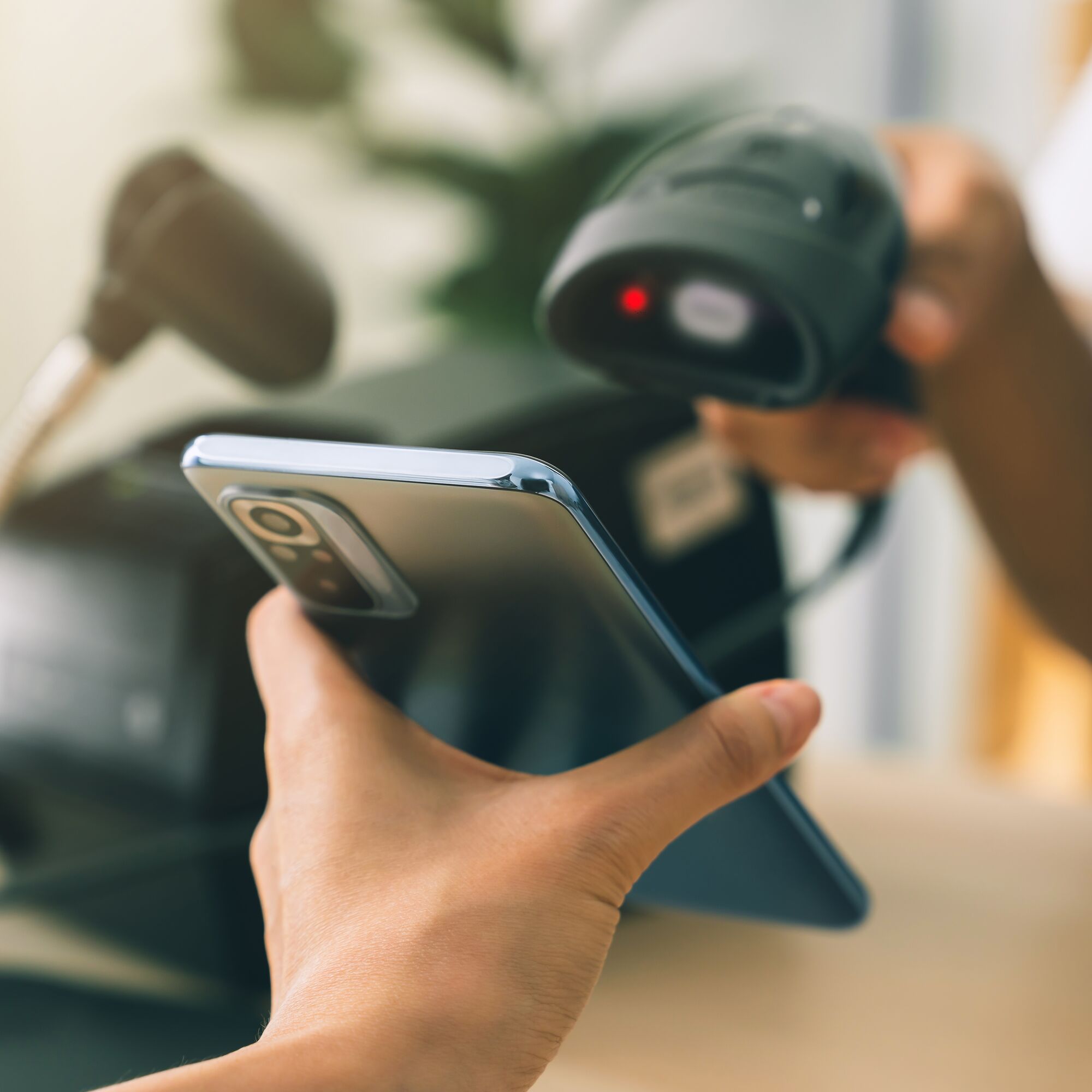Hand holding smartphone with scan barcode for payment, shopping online, Digital wallet concept.