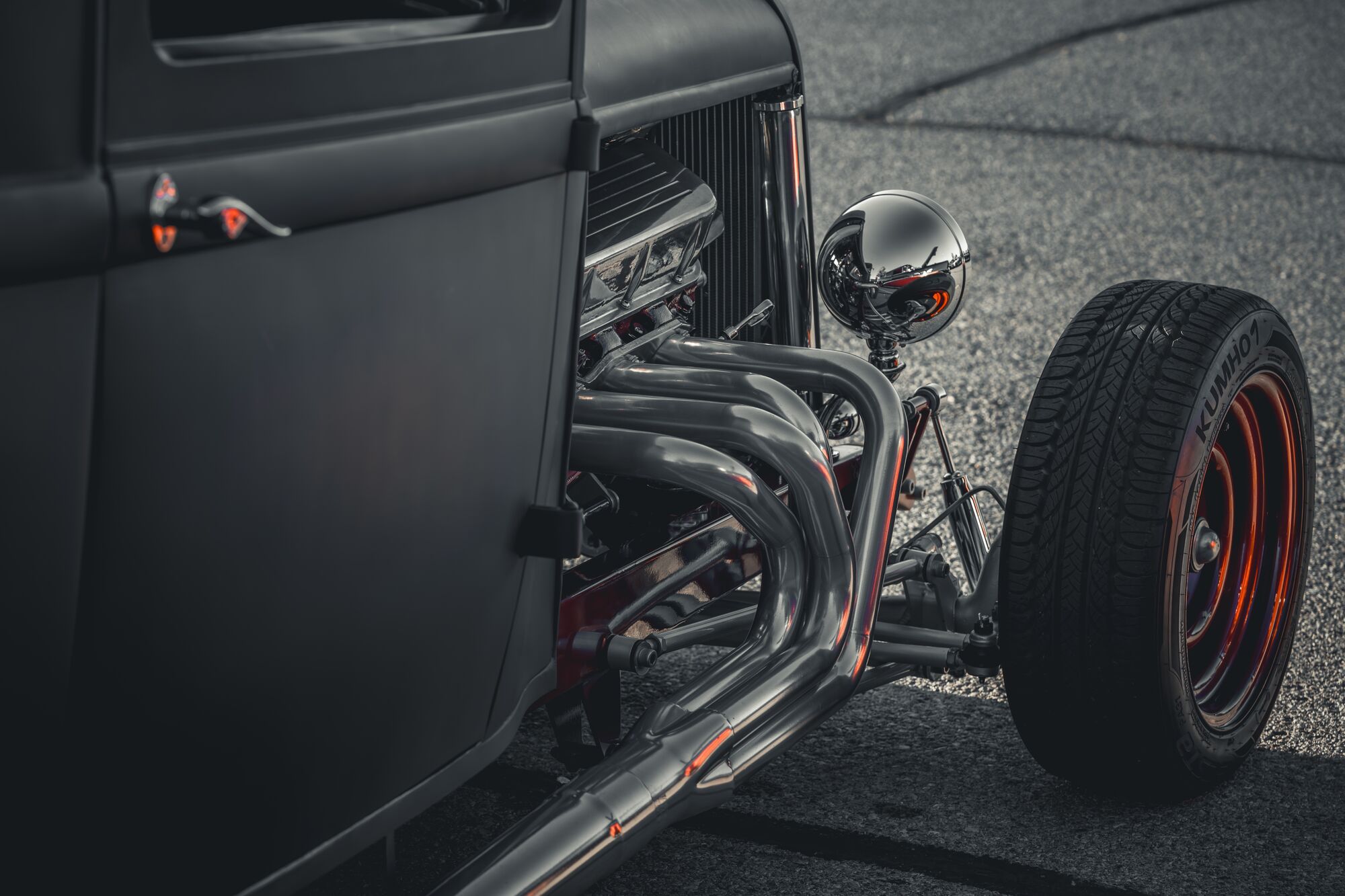 Side shot of an old Black and Red Hot Rod